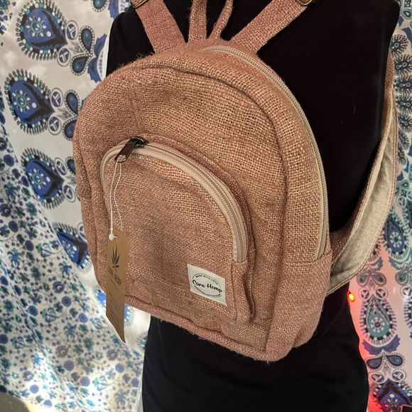 hemp mini backpack Core dye multicolor patterns Fully adjustable shoulder straps Double zipper compartments for organization Cotton lining for durability Water bottle holders on both sides Multiple interior pockets Anti NWT Core Hemp Mini Backpack